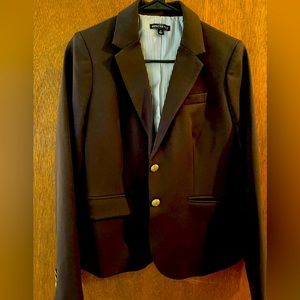 Black fitted J Crew blazer with pockets lined with stripes.